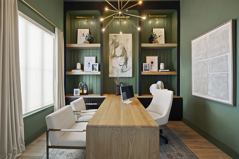 Custom cabinetry with beautiful lighting feature in this home office design.